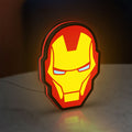 Iron Man LED lightbox standing on a desk from an angled side view with red glow