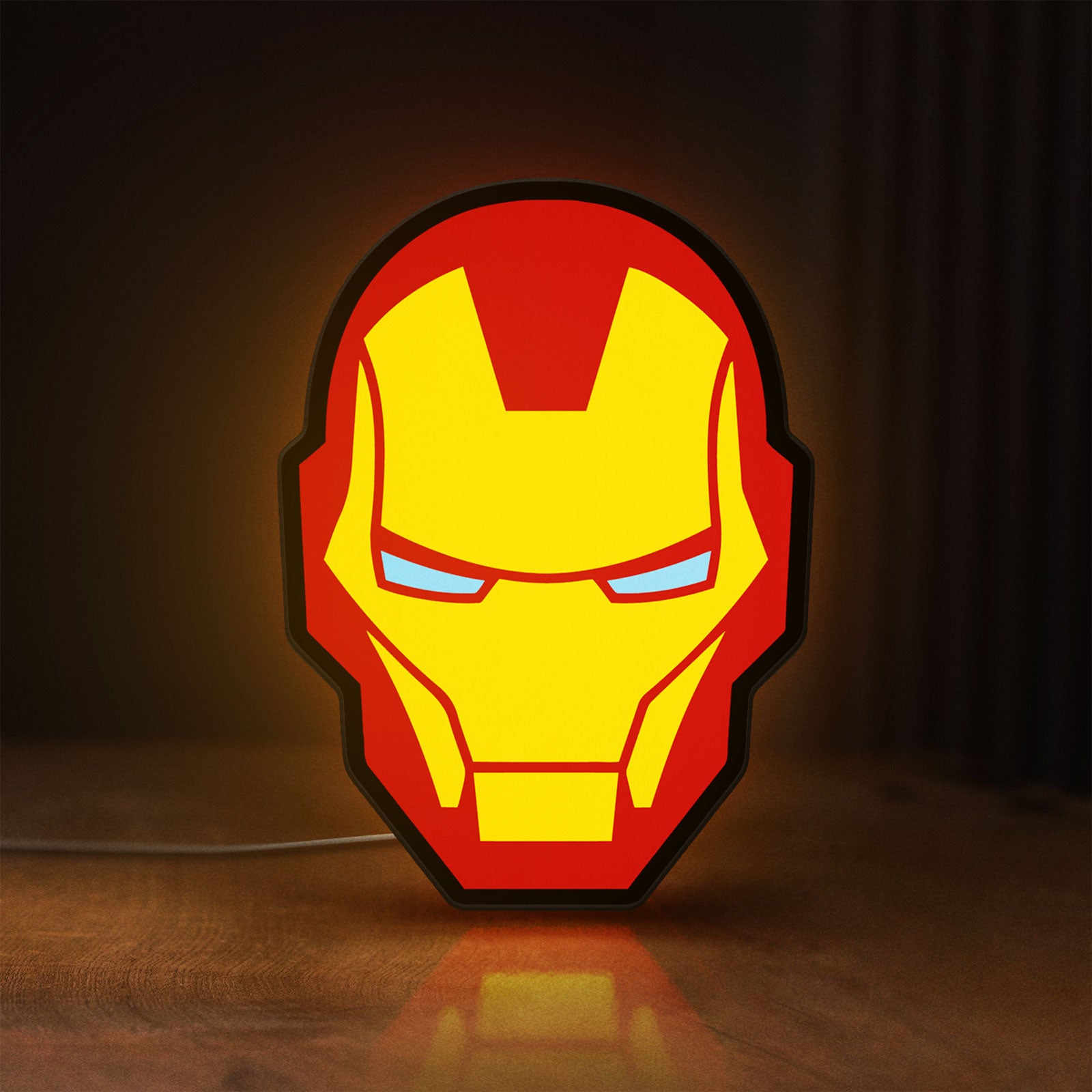 Front view of Iron Man LED lightbox sign glowing on a wooden desk