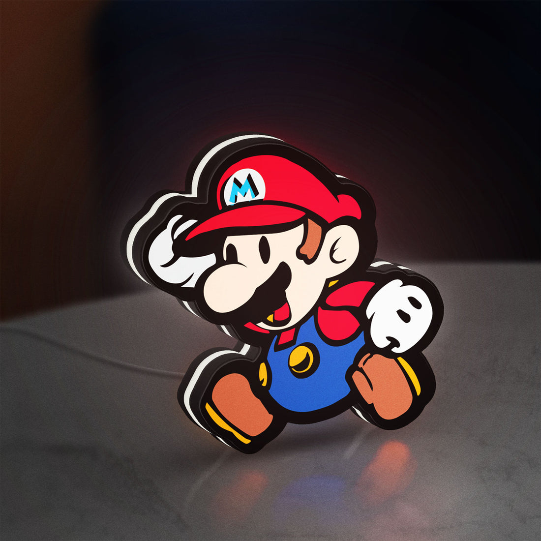 Super Mario LED lightbox hanging on a wall with white glow