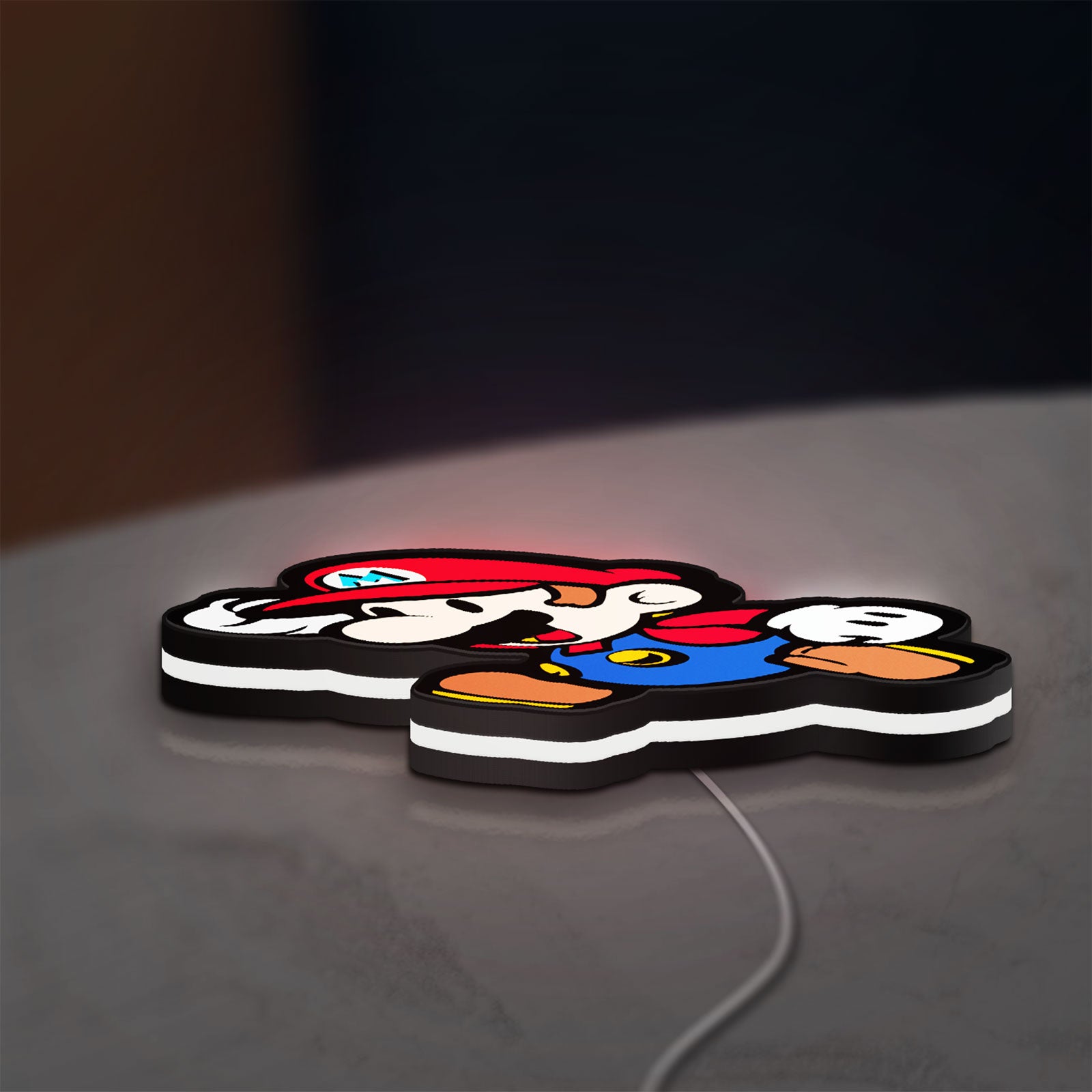 Super Mario LED lightbox lying flat on a desk with white glow