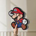 Unlit Super Mario LED lightbox held by hand to show size and details