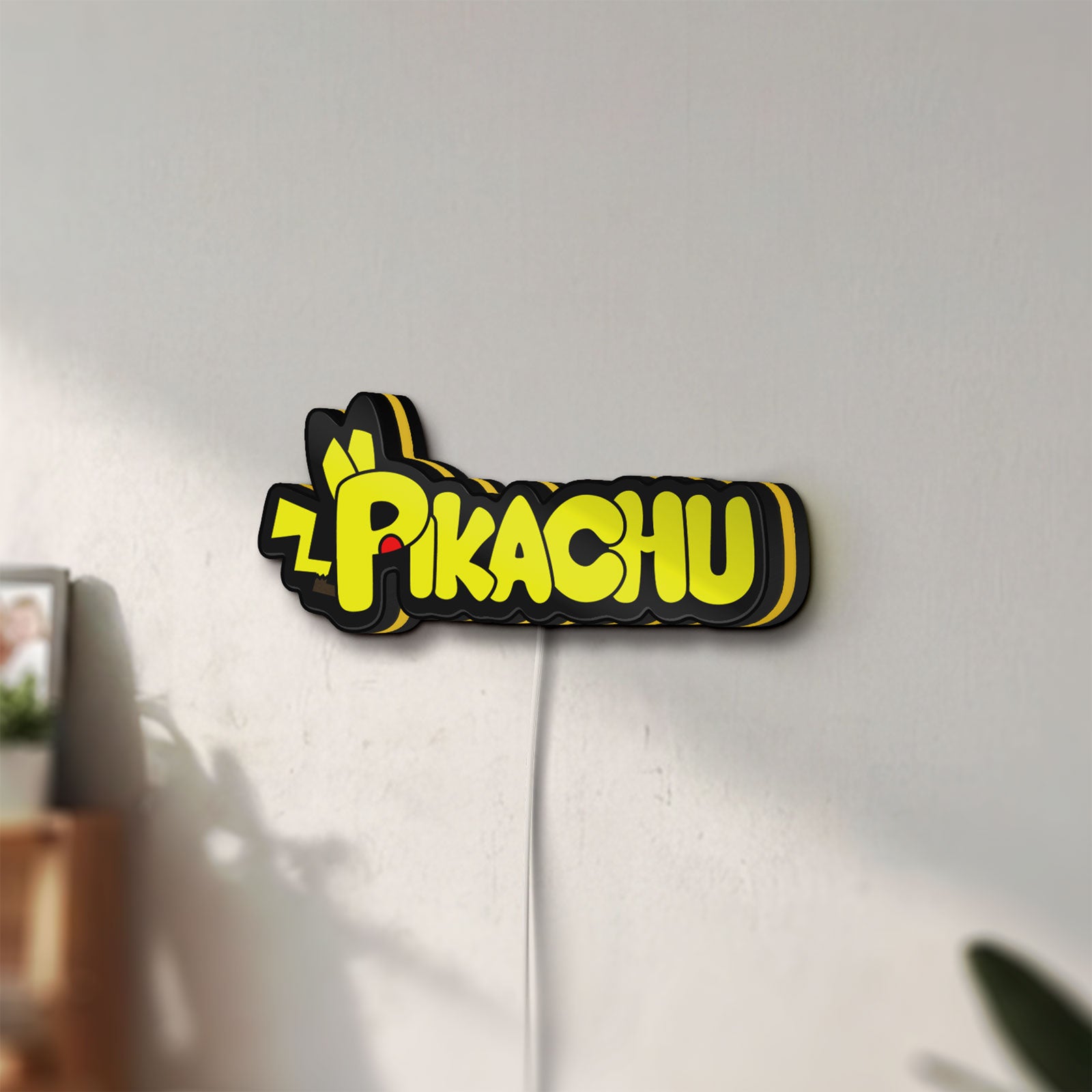 Unlit Pikachu LED lightbox mounted on a wall in daylight