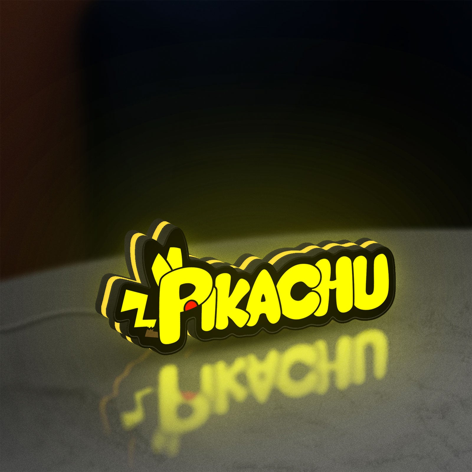 Pikachu LED lightbox standing on a desk from an angled side view with yellow glow