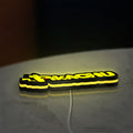 Pikachu LED lightbox lying flat on a desk with yellow glow
