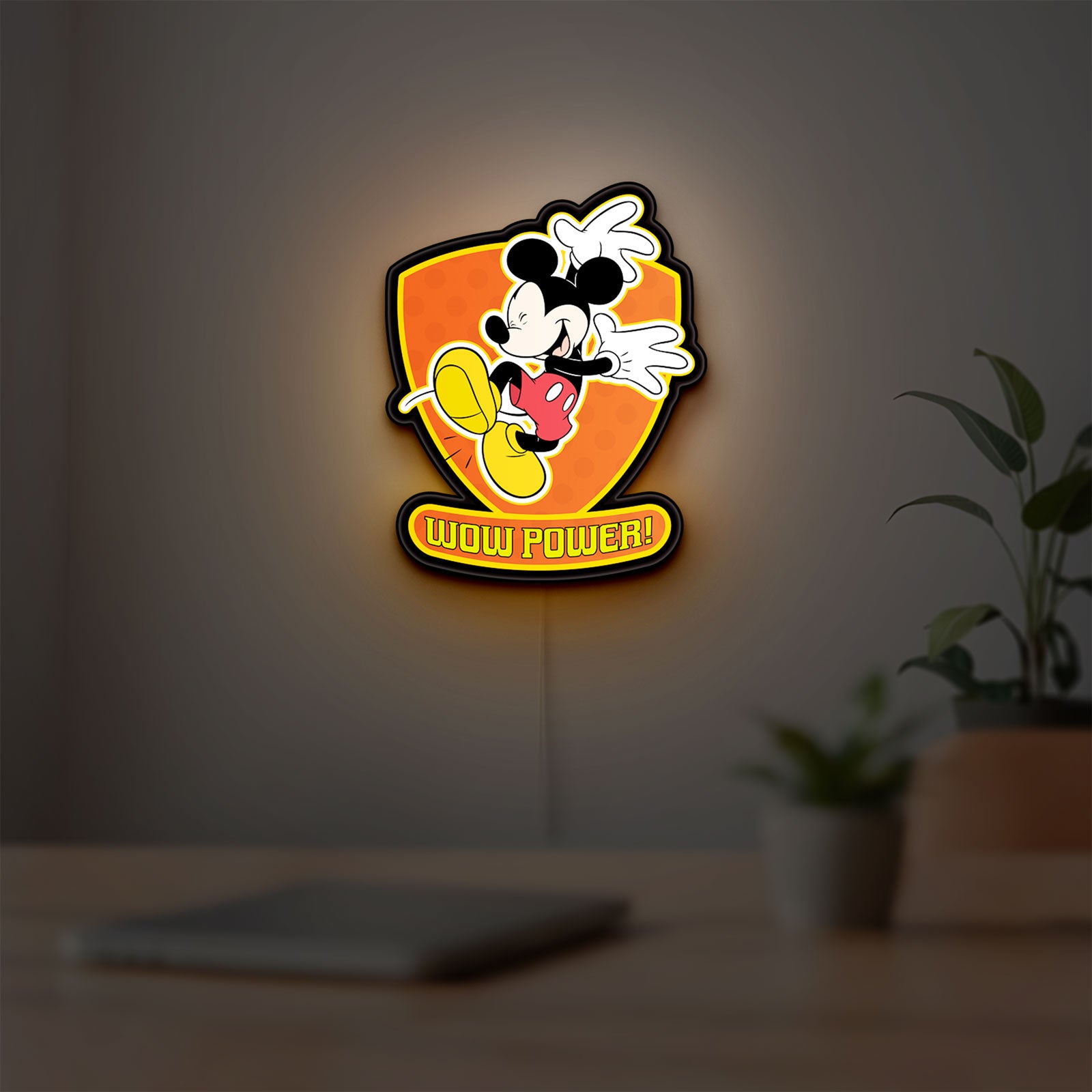 Mickey Mouse Inspired LED lightbox hanging on a room wall with soft yellow light