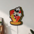 Unlit Mickey Mouse Inspired LED lightbox mounted on a wall in daylight