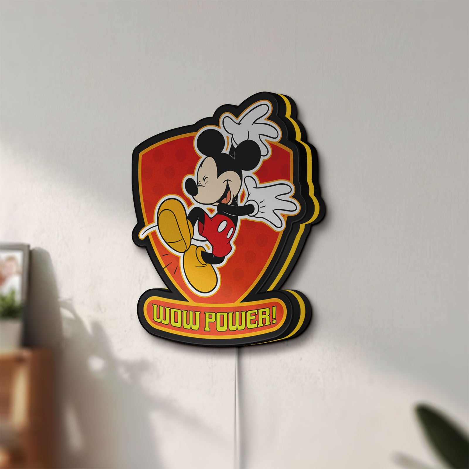 Unlit Mickey Mouse Inspired LED lightbox mounted on a wall in daylight