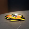 Mickey Mouse Inspired LED lightbox lying flat on a desk with yellow glow