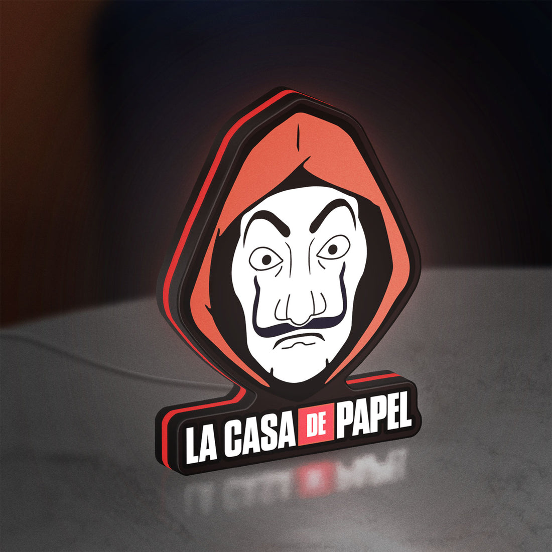 La Casa De Papel LED lightbox hanging on a wall with red glow