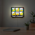 That's Donald LED lightbox hanging on a room wall with soft white light