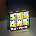 That's Donald LED lightbox standing on a desk from an angled side view with white glow