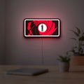 James Bond 007 LED lightbox hanging on a room wall with soft red light