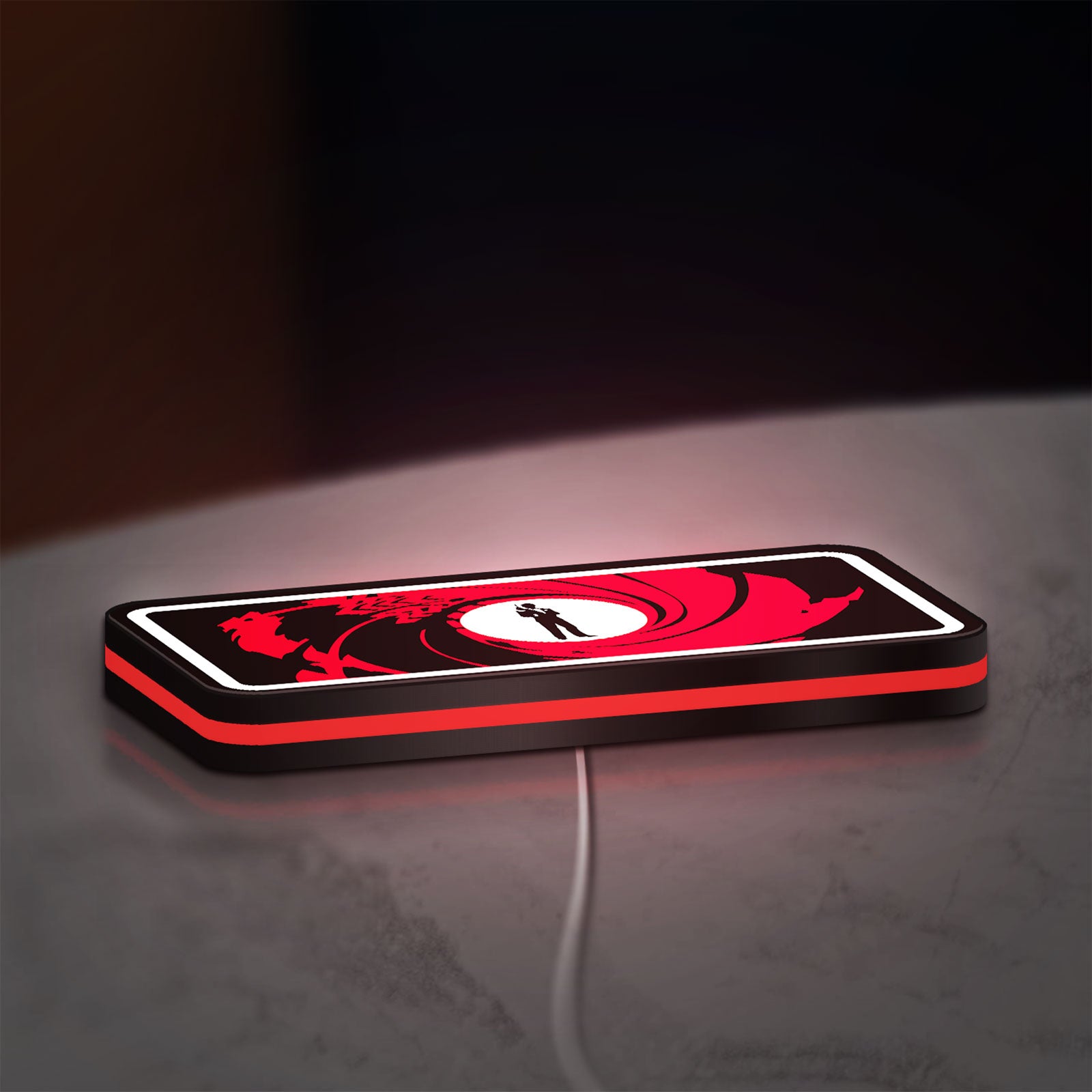 James Bond 007 LED lightbox lying flat on a desk with red glow