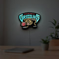 Memphis Grizzlies LED lightbox hanging on a room wall with soft white light