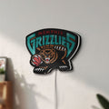 Unlit Memphis Grizzlies LED lightbox mounted on a wall in daylight