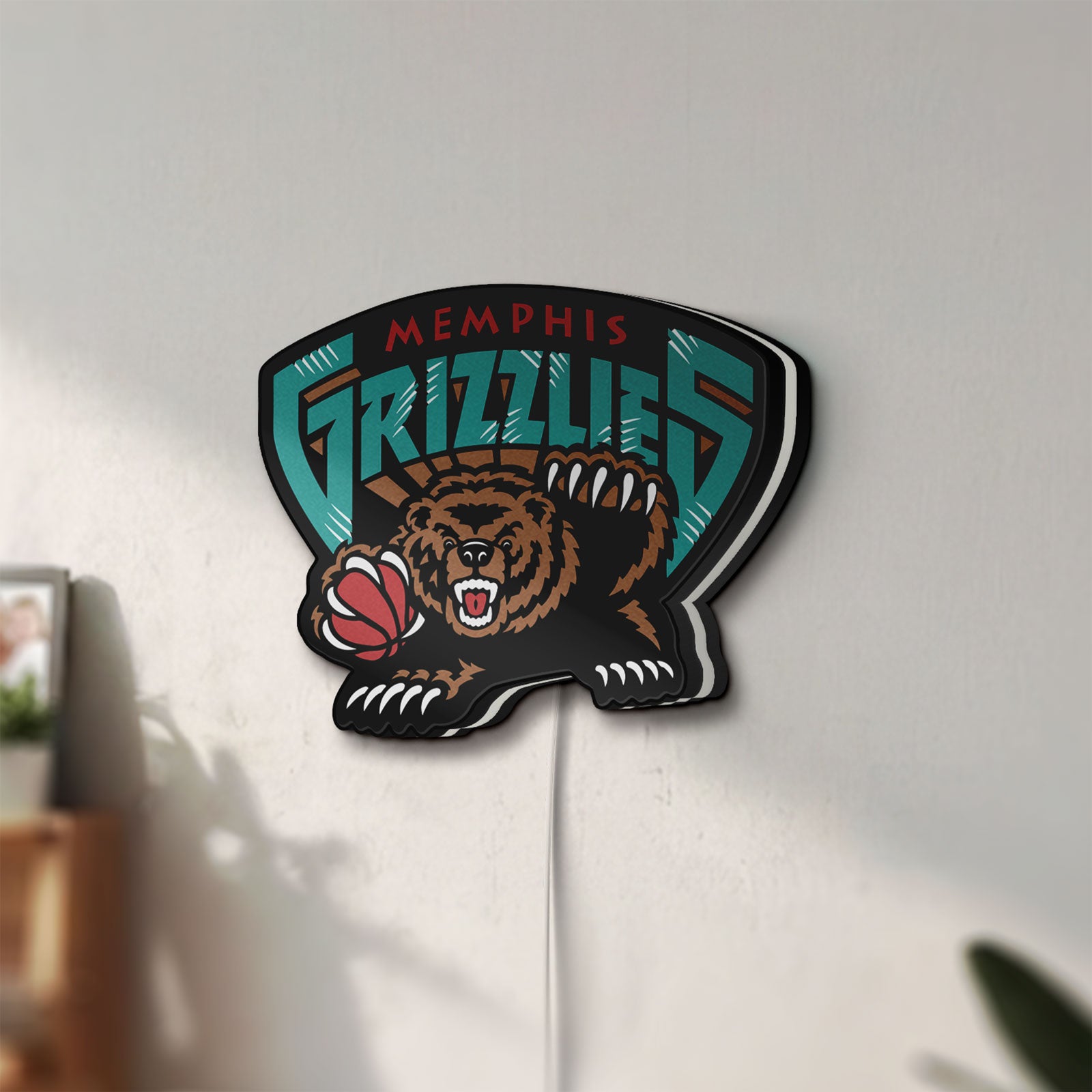 Unlit Memphis Grizzlies LED lightbox mounted on a wall in daylight