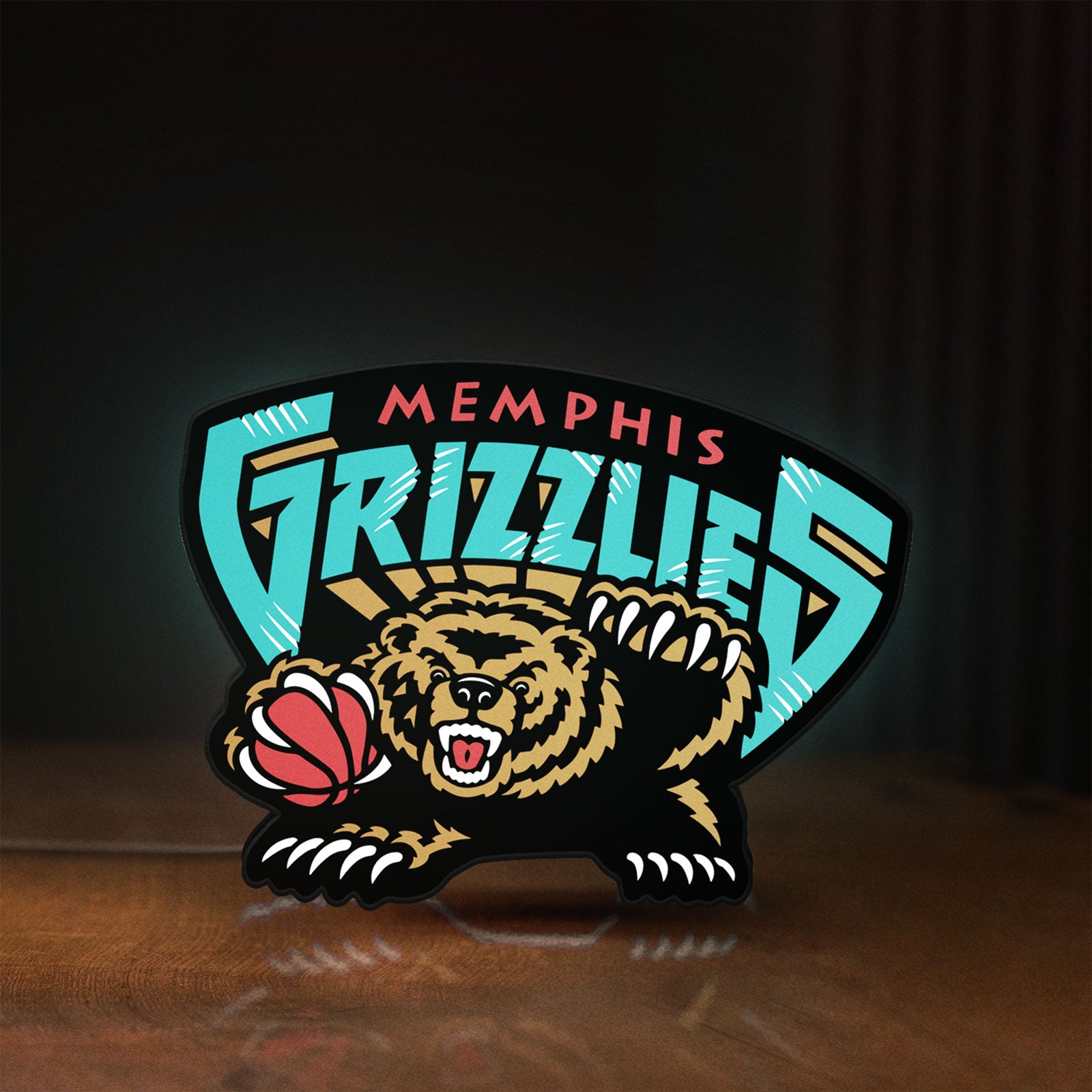 Front view of Memphis Grizzlies LED lightbox sign glowing on a wooden desk