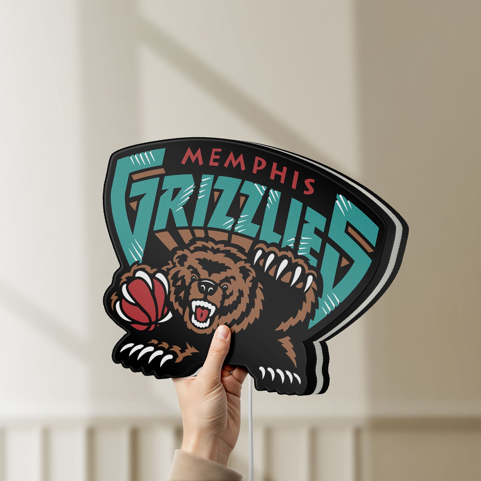 Unlit Memphis Grizzlies LED lightbox held by hand to show size and details