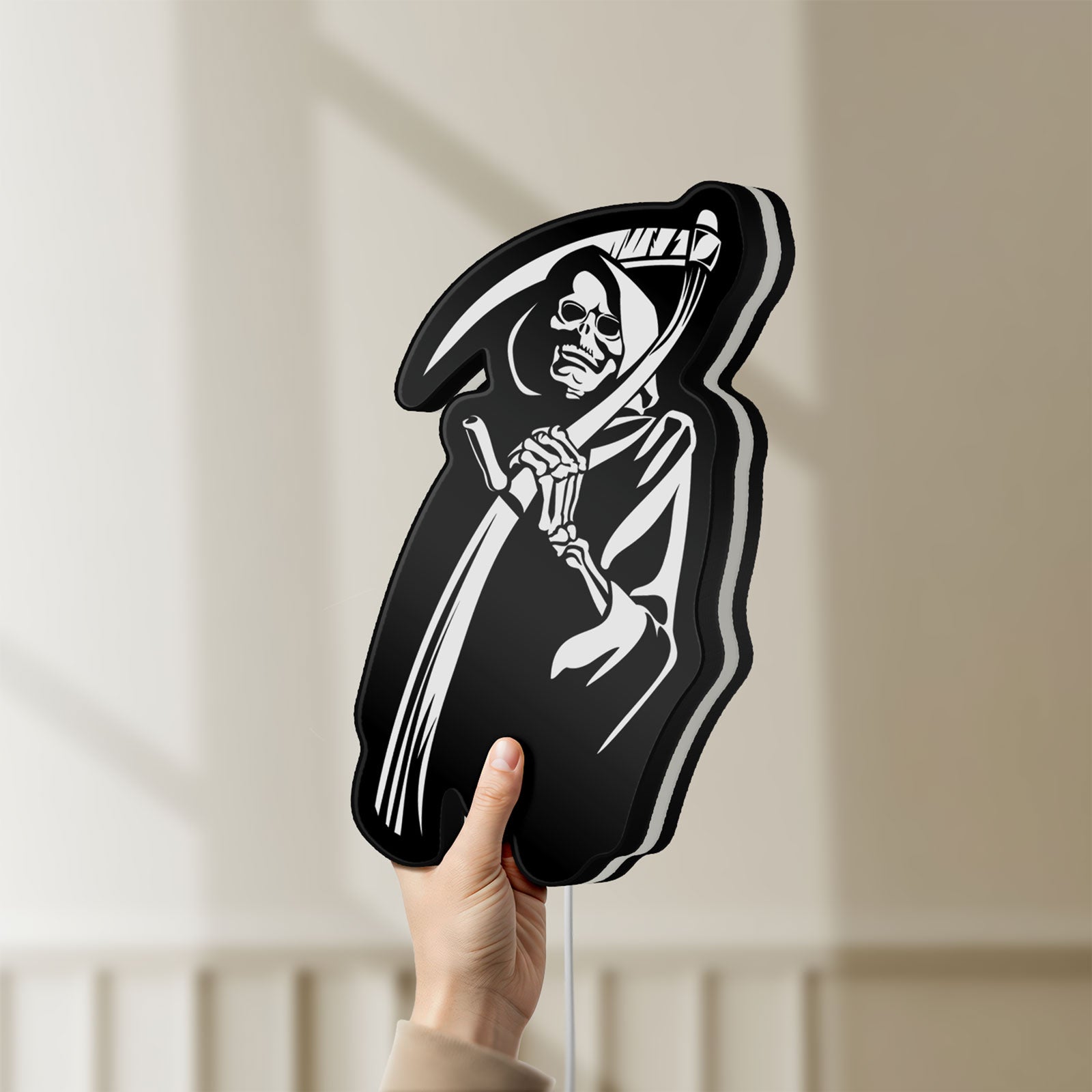 Unlit Death Metal LED lightbox held by hand to show size and details