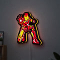 Iron Man LED lightbox hanging on a wall with yellow glow
