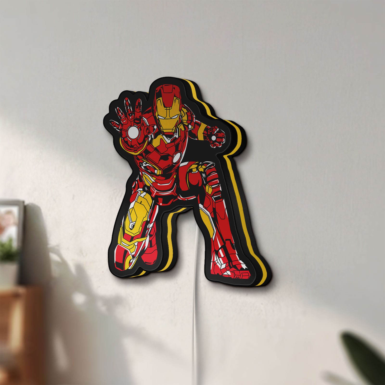 Unlit Iron Man LED lightbox mounted on a wall in daylight