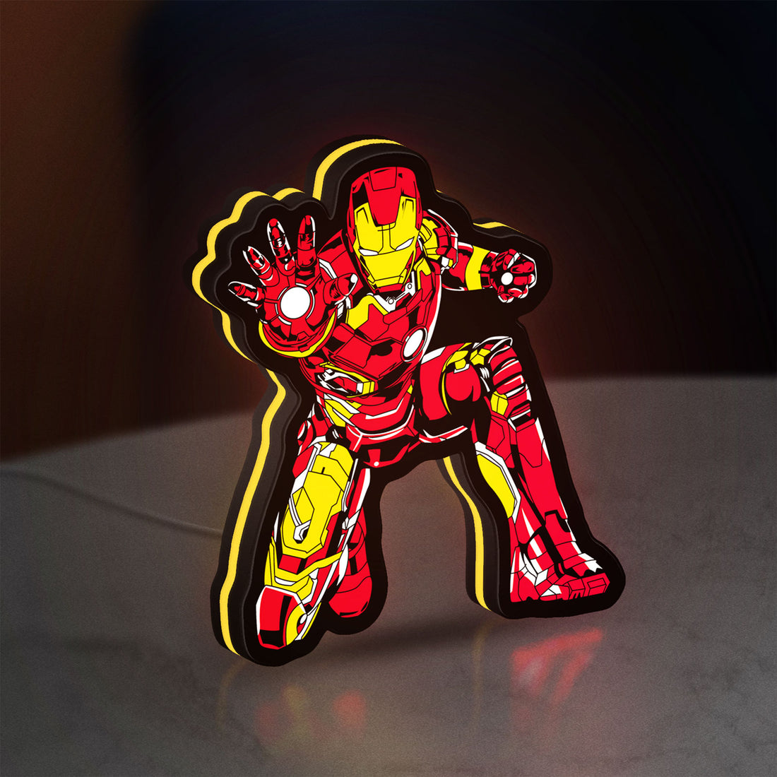 Iron Man LED lightbox hanging on a wall with yellow glow