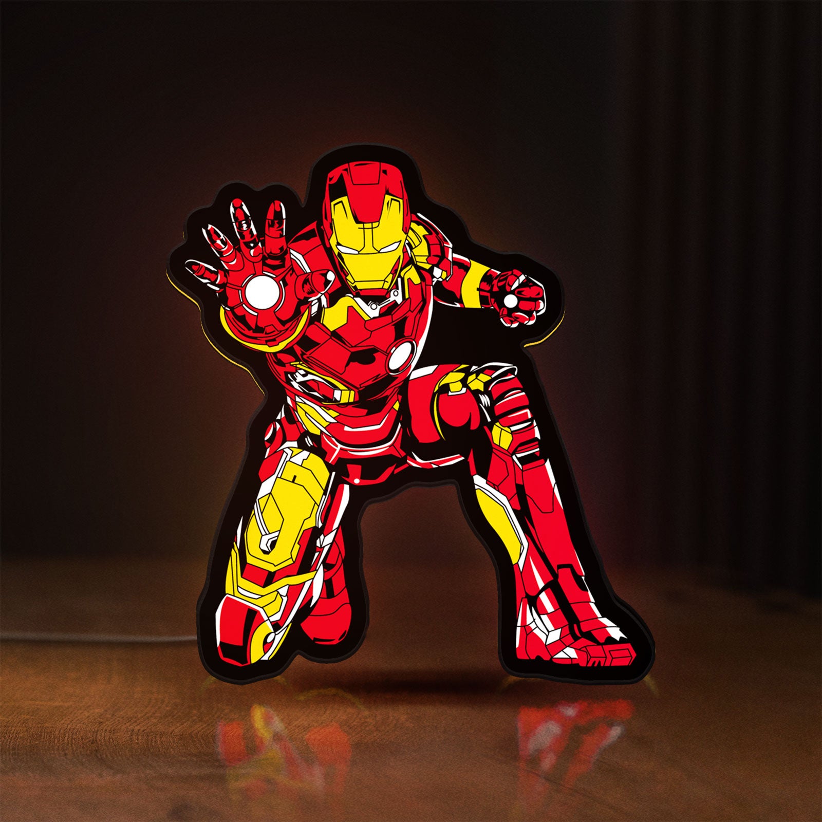 Front view of Iron Man LED lightbox sign glowing on a wooden desk