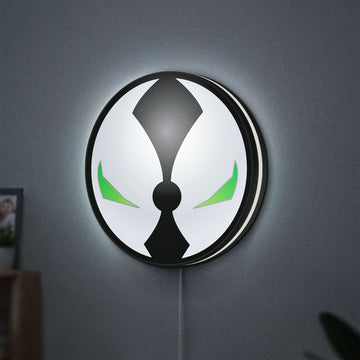 Spawn Mask LED lightbox hanging on a wall with white glow