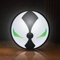 Front view of Spawn Mask LED lightbox sign glowing on a wooden desk