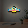 Mickey Mouse LED lightbox hanging on a room wall with soft blue light