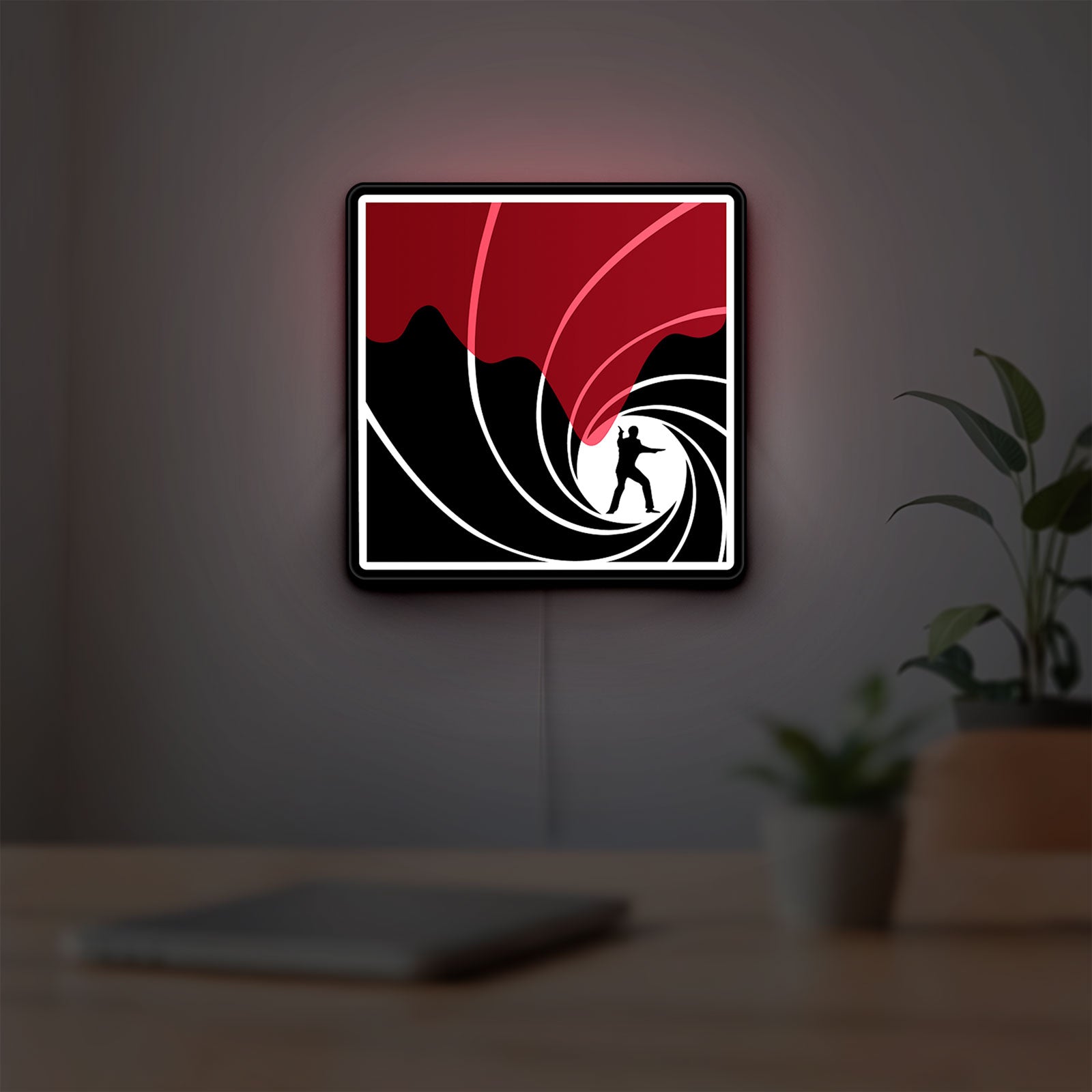 James Bond 007 LED lightbox hanging on a room wall with soft red light