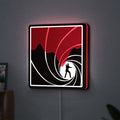 James Bond 007 LED lightbox hanging on a wall with red glow