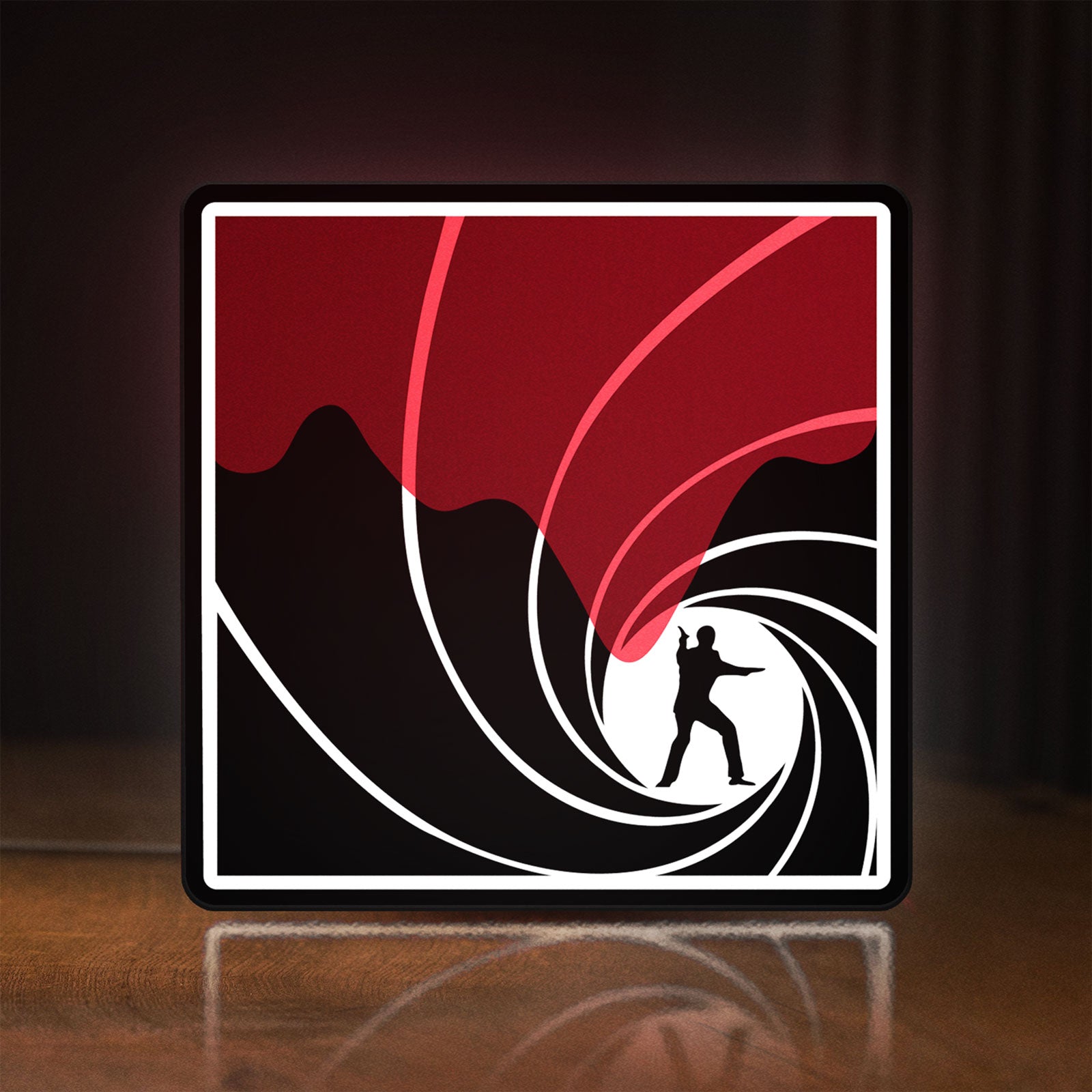 Front view of James Bond 007 LED lightbox sign glowing on a wooden desk