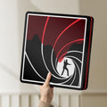 Unlit James Bond 007 LED lightbox held by hand to show size and details