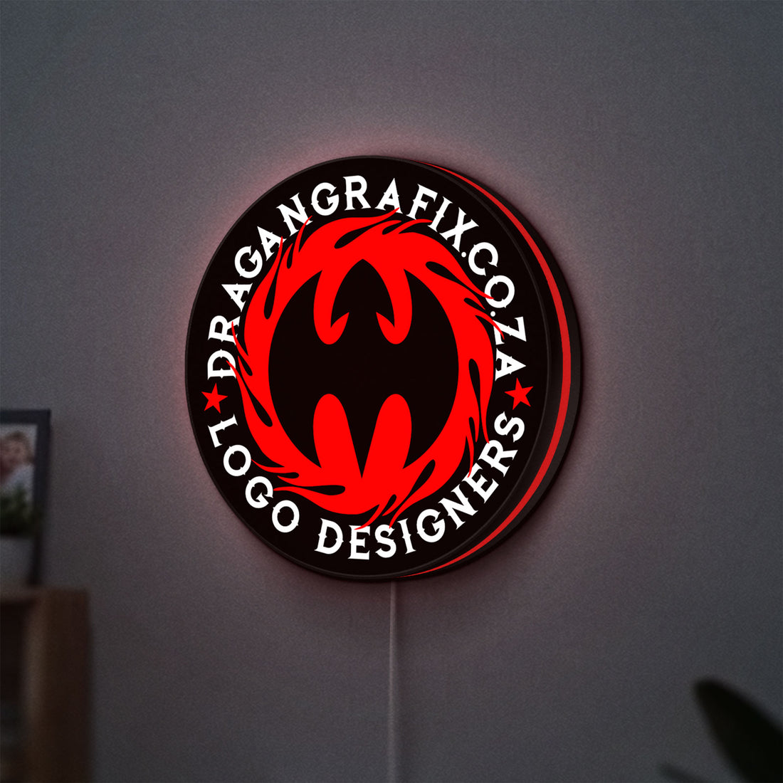 Custom LED Logo Sign LED lightbox hanging on a wall with red glow