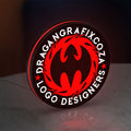 Custom LED Logo Sign LED lightbox standing on a desk from an angled side view with red glow