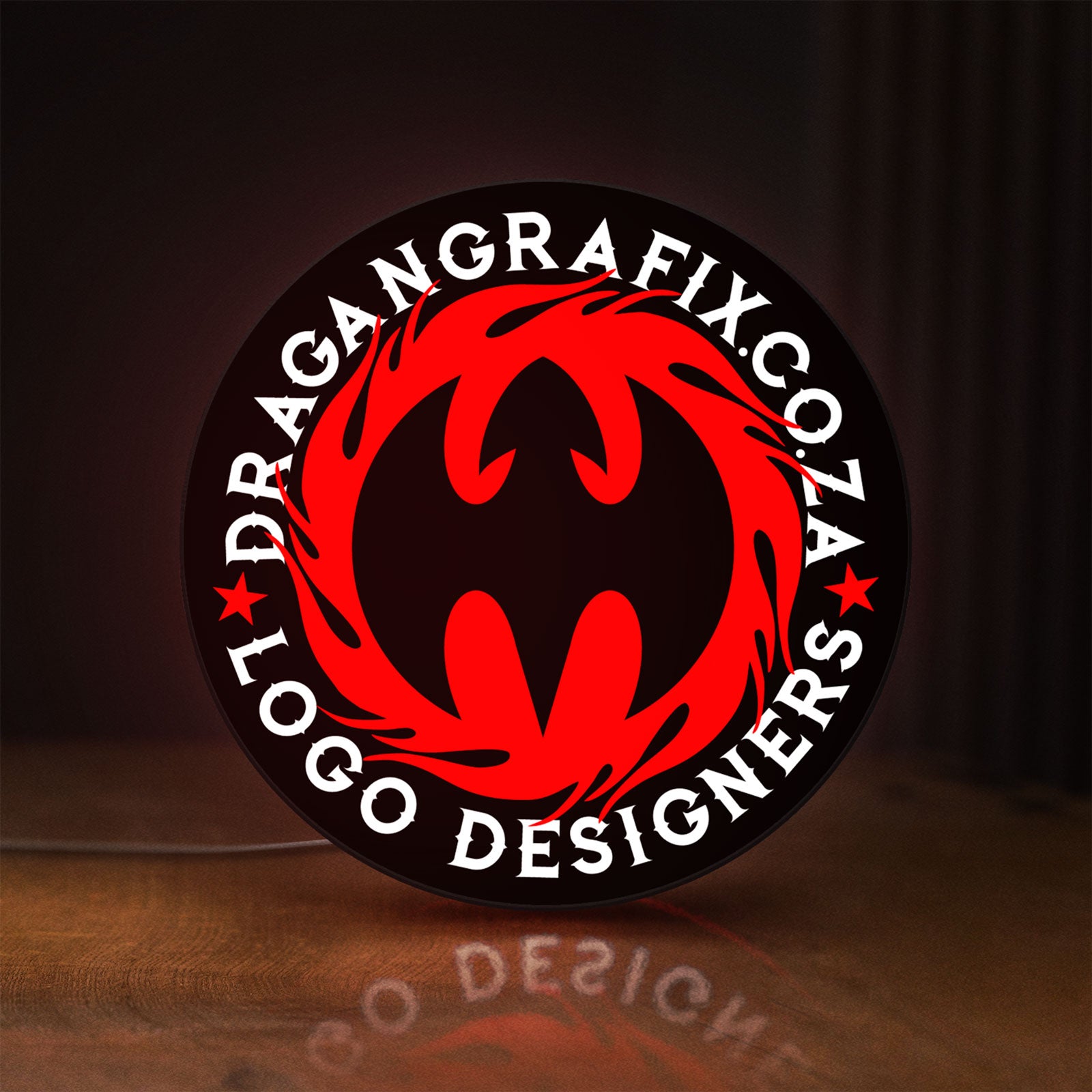 Front view of Custom LED Logo Sign LED lightbox sign glowing on a wooden desk