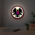 S.H.I.E.L.D. LED lightbox hanging on a room wall with soft white light