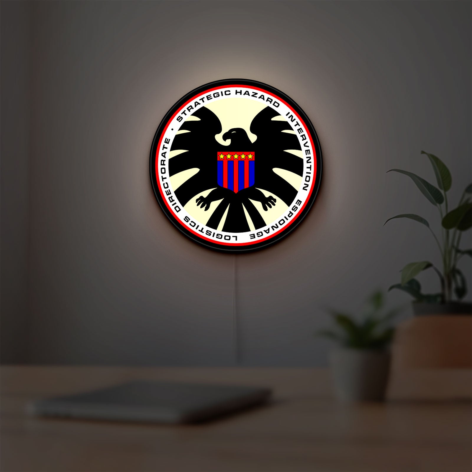 S.H.I.E.L.D. LED lightbox hanging on a room wall with soft white light