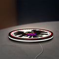 S.H.I.E.L.D. LED lightbox lying flat on a desk with white glow