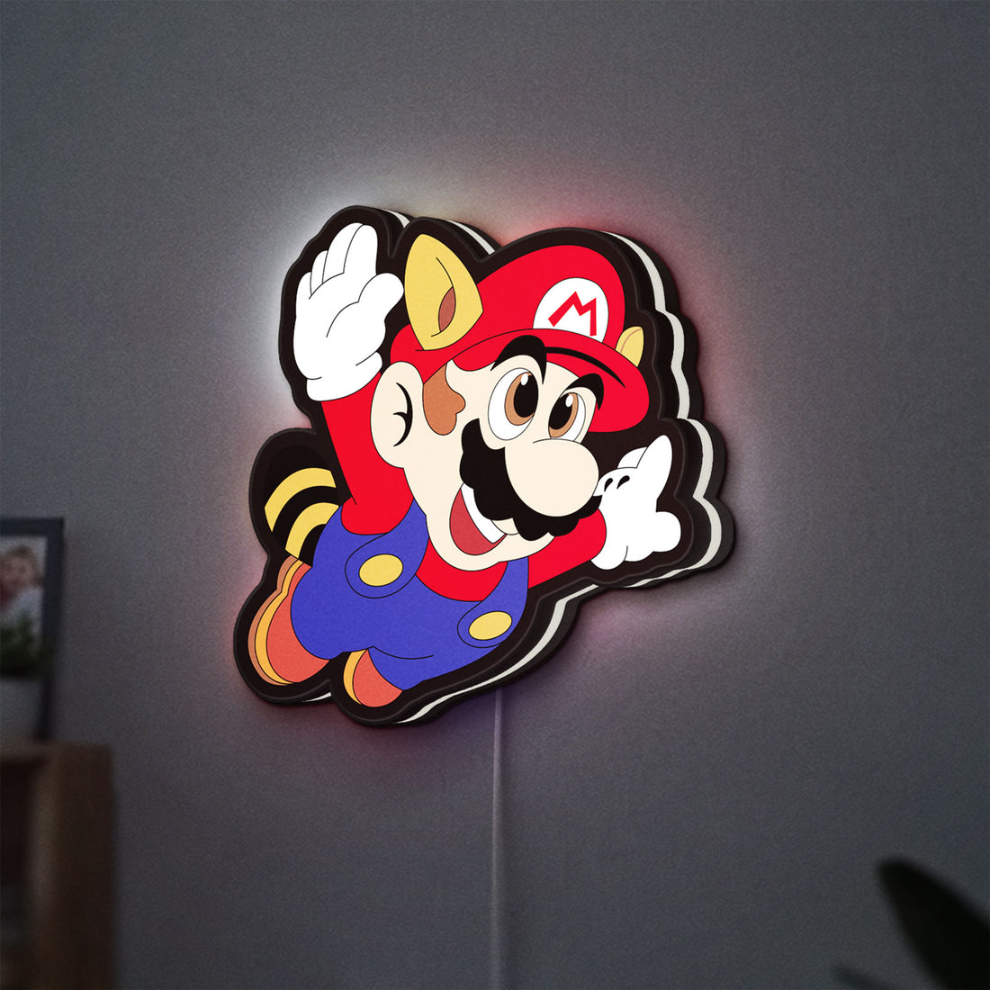 Super Mario LED lightbox hanging on a wall with white glow
