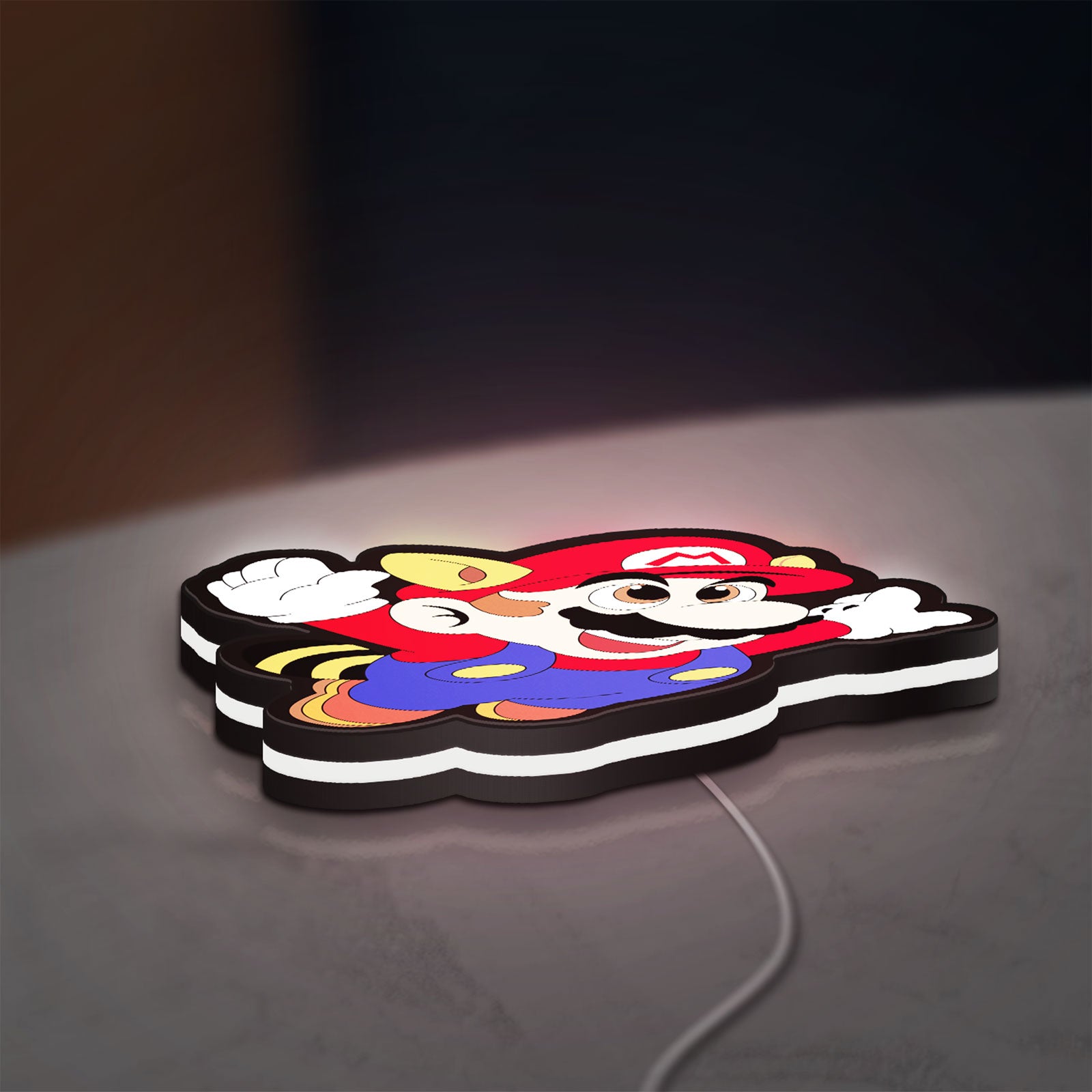 Super Mario LED lightbox lying flat on a desk with white glow