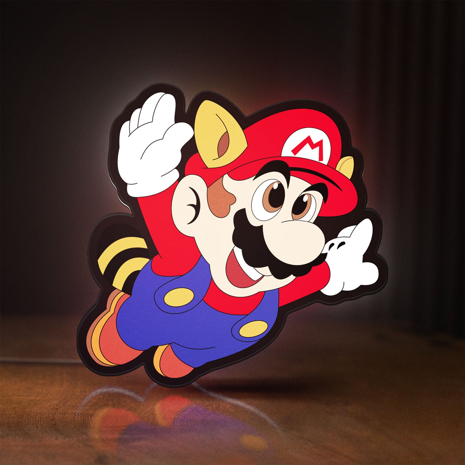 Front view of Super Mario LED lightbox sign glowing on a wooden desk