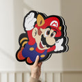Unlit Super Mario LED lightbox held by hand to show size and details