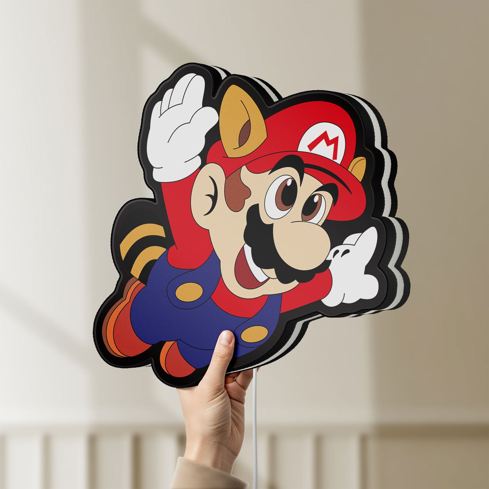 Unlit Super Mario LED lightbox held by hand to show size and details