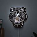 KENZO PARIS LED lightbox hanging on a wall with white glow
