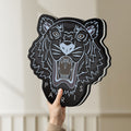 Unlit KENZO PARIS LED lightbox held by hand to show size and details