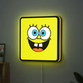 Spongebob Squarepants LED lightbox hanging on a wall with yellow glow