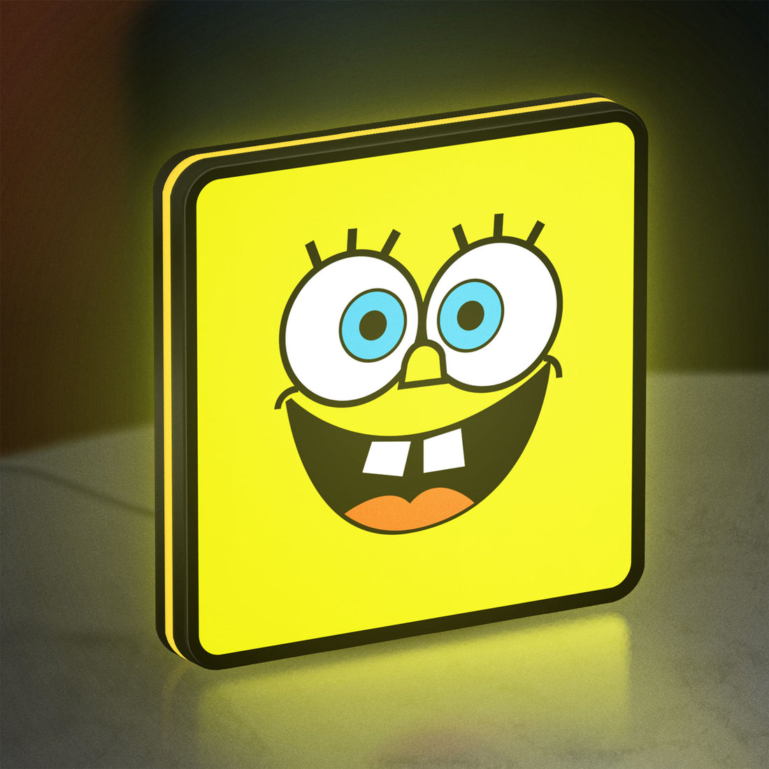 Spongebob Squarepants LED lightbox hanging on a wall with yellow glow
