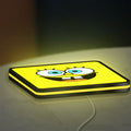 Spongebob Squarepants LED lightbox lying flat on a desk with yellow glow
